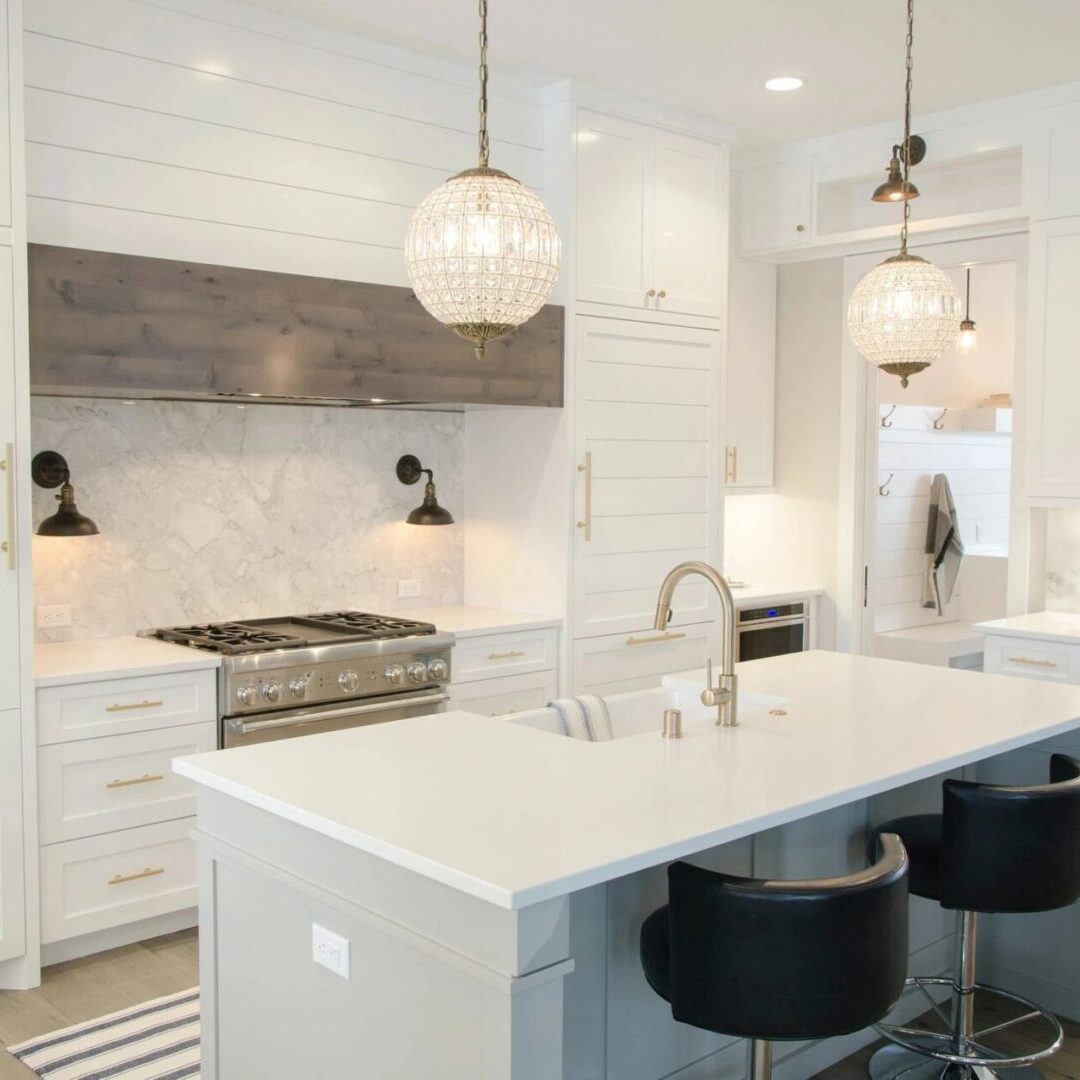 Bright white kitchen island with pendant lights